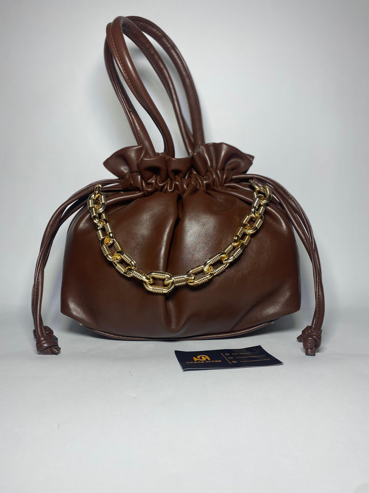 "Moonlit Mosaic: A Potli of Tradition Reimagined with Modern Grace and Timeless Artisan Detailing"