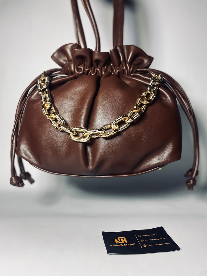 "Moonlit Mosaic: A Potli of Tradition Reimagined with Modern Grace and Timeless Artisan Detailing"