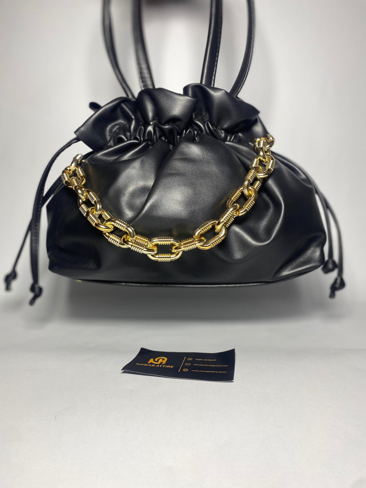 "Moonlit Mosaic: A Potli of Tradition Reimagined with Modern Grace and Timeless Artisan Detailing"